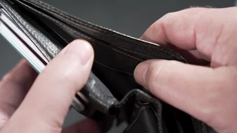 Close-up hands open a wallet and reveal it empty. Stock Footage 322924597