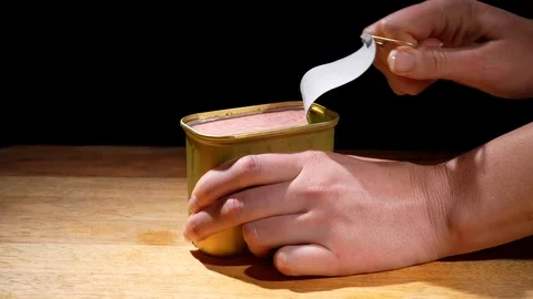 Close up hands opening canned ham Stock Footage 126327836