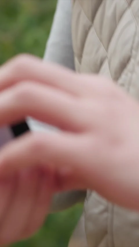 Close up of hands opening empty black ring box on beige quilted jacket sleeve in Stock Footage 345543410