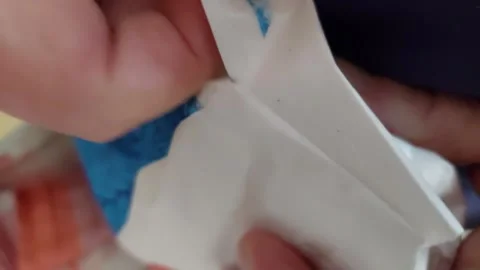 Close up of hands opening a plastic food packaging Stock Footage 334333044