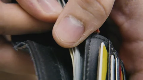 Close up of hands opening wallet revealing cash and cards for payment finance Stock Footage 340914387