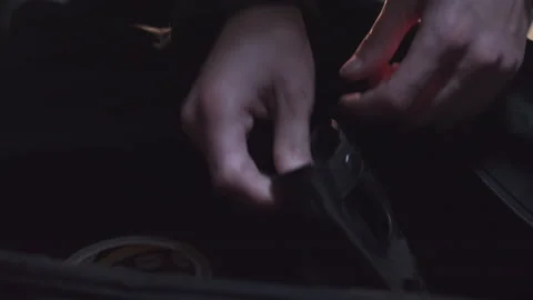 Close up of hands opening zipper of bag and pulls on leather gloves in Stock Footage 231080068