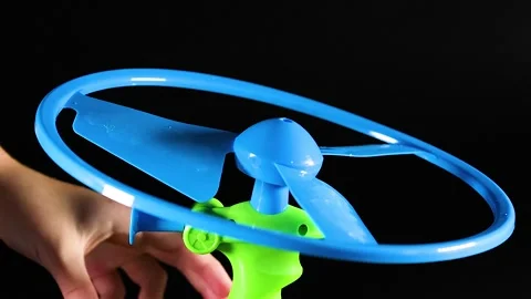 Close Up of Hands Operating a Blue and Green Flying Toy Video stock 326019551