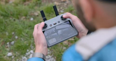 Close Up of Hands Operating Drone Remote Control Joysticks Stock Footage 345021868