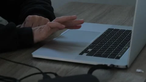 Close-up of hands operating a laptop with a touchpad. Conceptual meaning Stock Footage 312870951