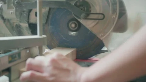 Close-Up of Hands Operating a Precision Cutting Tool Stock Footage 327577897