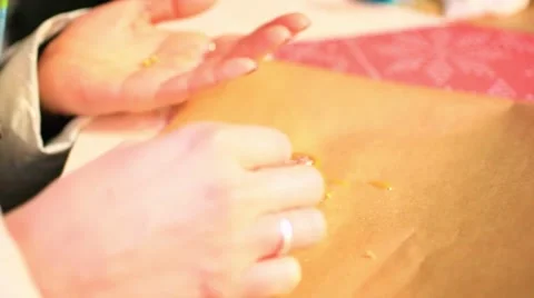 Close-up of hands painting with gingerbread cookie and pipping bag. Does Of Video stock 47544831