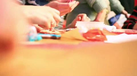 Close-up of hands painting with gingerbread cookie and pipping bag. HD Stock Footage 47544847