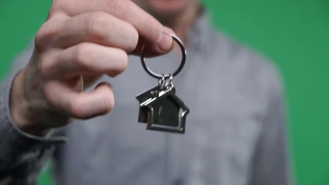 Close-up hands pass home keys. Key to a new home. Green screen Video stock 102826133