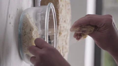 Close up of hands of pastry chef crushing baked sheet dough, vertical video Stock Footage 240753747