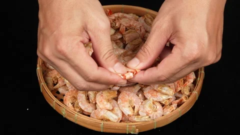 Close Up Hands Peeling Dried Shrimp Shell In Bamboo Basket 스톡 동영상 337778731