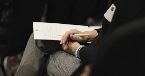 Close up. Hands with pen and sheet of paper. Stock Footage 83092644