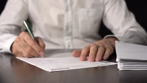 Close-up of Hands with Pen on Paper Documents Sitting Vídeos de archivo 157536605