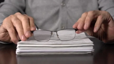 Close-up of Hands with Pen on Paper Documents Sitting Stock Footage 166996336