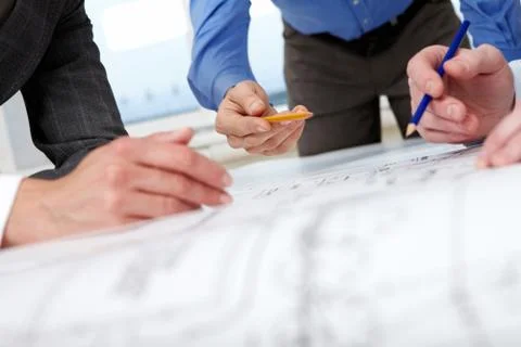Close-up of hands with pencils over a draft Stock Photos