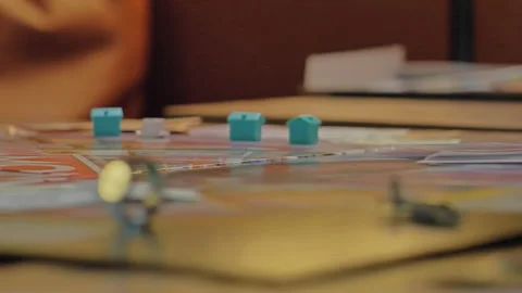 Close-up of the hands of people playing the game Monopoly. Stock Footage 140970463