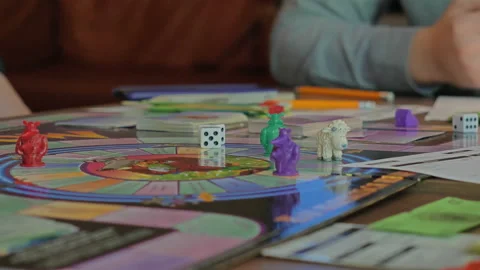 Close-up of the hands of people playing the game Monopoly. Stock-Footage 140972083