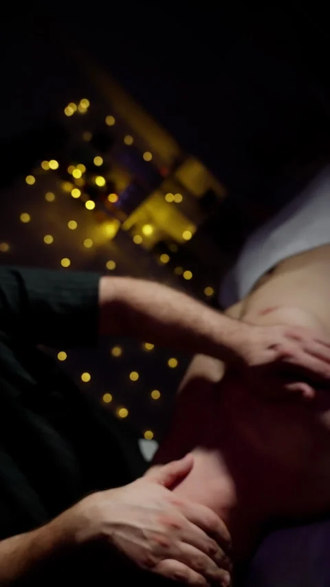 Close-up of hands performing abdominal massage Stock Footage 261711686