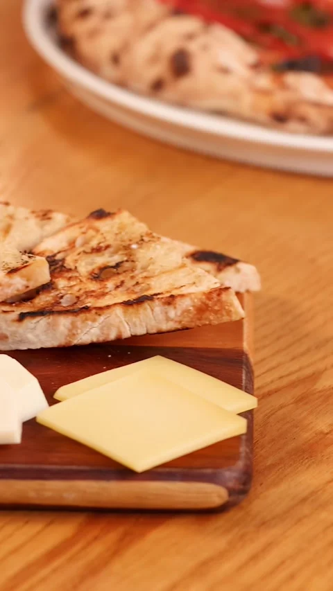 Close Up of Hands Placing Cheese Board on Restaurant Table 스톡 동영상 337925666