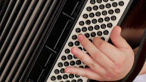 Close up on hands playing accordion Stock Footage 78234394