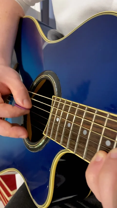 Close-up of hands playing acoustic guitar Stock Footage 168608062