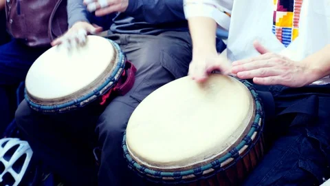 Close Up Of Hands Playing African Drum Djembe. Summer evening. Slow motion Stock Footage