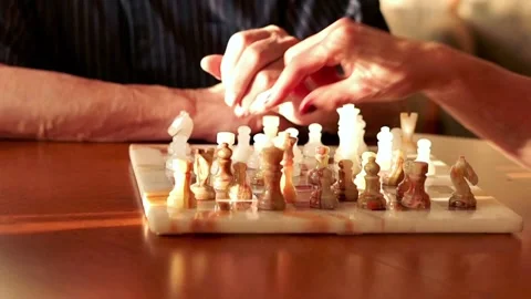 Close-up of hands playing chess, super slow motion Stock Footage 101383141