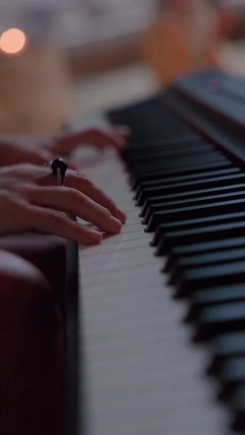 Close-Up of Hands Playing Digital Piano at Home Gathering Stock Footage 312382314