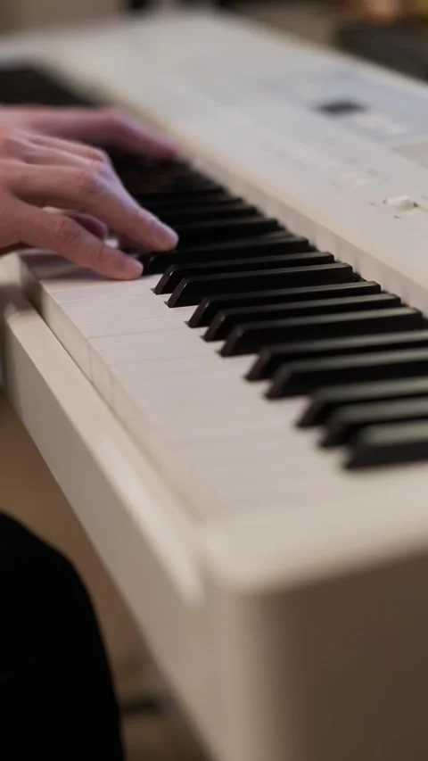Close-Up Hands Playing Digital Piano Vertical Music Practice Stock Footage 331905234