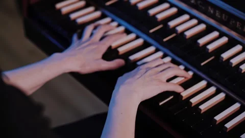 Close-Up: Hands Playing Electric Keyboard in Studio Performance Video stock 336150894