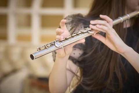 Close-Up of Hands Playing a Flute Gracefully Stock Photos