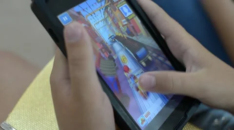 Close up Hands Playing Game at Tablet Subway Surfers Stock Footage 67272986