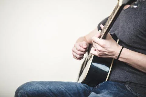 Close up of hands playing guitar Stock Photos