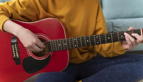 Close up hands playing guitar Stock Photos