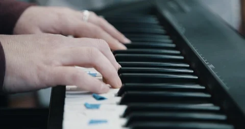 Close up of hands playing piano in slow motion Video stock 96575282