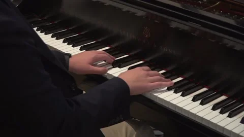 Close up of hands playing piano tracking shot Stock Footage 149604075