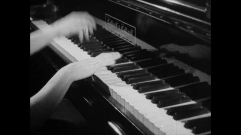 Close up of hands playing piano, typing with typewriter fast, UK 1945 Stock Footage 133385197