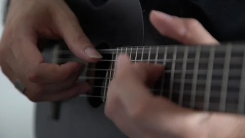 Close-up hands playing small guitar 스톡 동영상 125631634