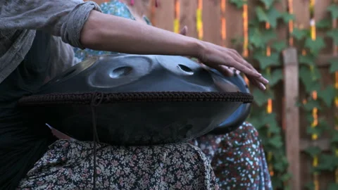 Close-up of hands playing the tank drum Stock Footage 151364150