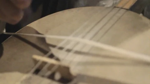 Close up of hands playing a traditional Georgian  string instrument, the Stock Footage 106928816