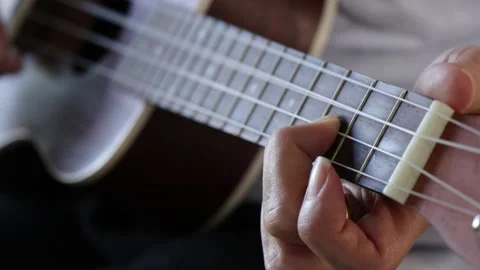 Close up hands playing ukulele. Stock Footage 135590506