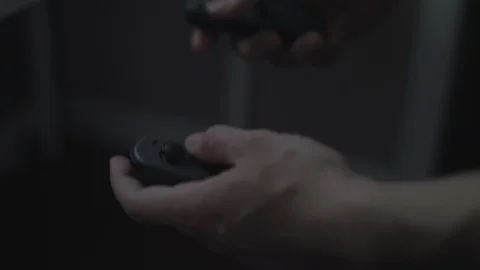 Close up of hands playing with/using dual black video game controllers. Stock Footage 90211877