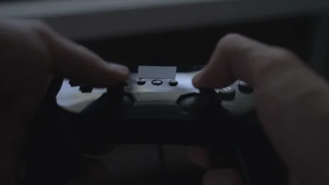 Close up of hands playing with/using a generic black video game controller in 4k Stock Footage 90262933