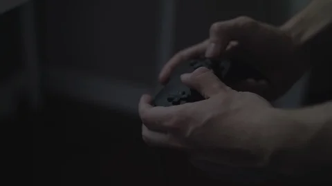 Close up of hands playing with/using a generic black video game controller in 4k Stock Footage 90268267