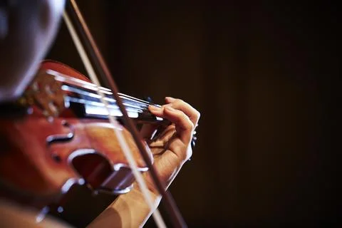 Close-up of hands playing the violin Stock Photos