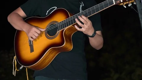 Close up of hands playing yellow guitar 動画素材 85040992