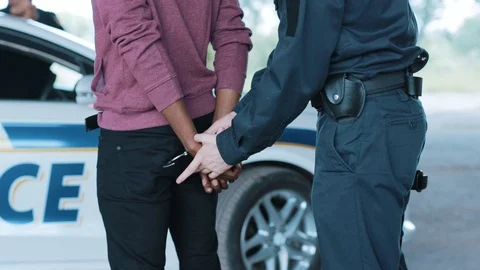 Close up hands policeman arrest man handcuffed criminal handcuffs justice Video stock 113005473