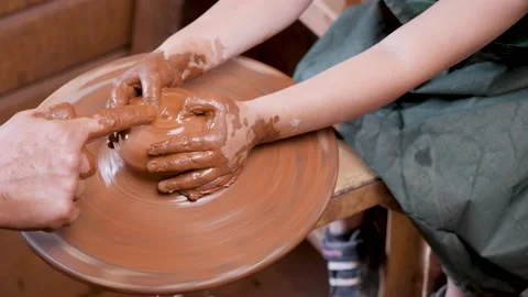 Close up hands pottery wheel pot clay potter child craft. Ceramic artist hand Stock Footage 158879460