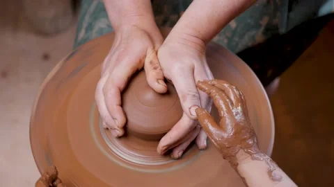 Close up hands pottery wheel pot clay potter child craft art education. Ceramic Stock Footage 158879644