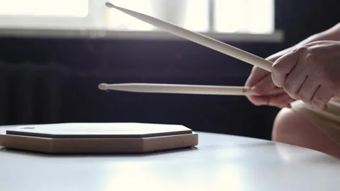 Close-up of hands practicing drum beats on a practice pad Stock Footage 341969119
